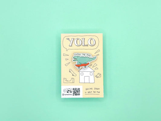 Packaging with a cartoon crocodile on a light green background, it says "enjoy the ride"