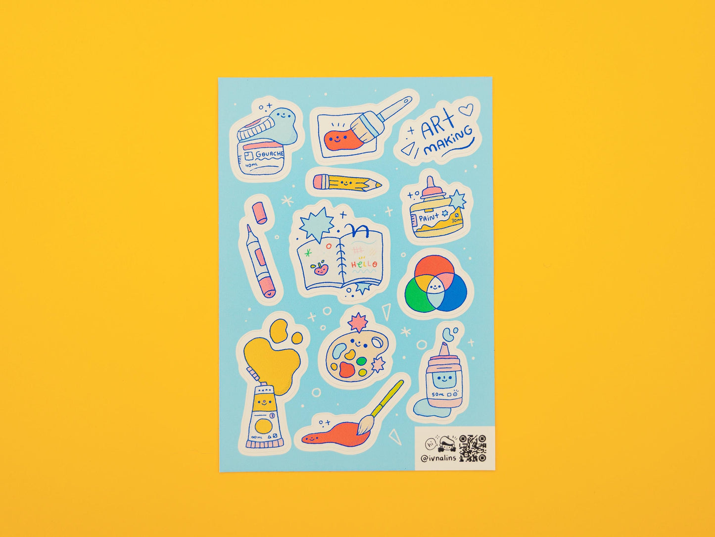 Sticker sheet with illustrations of art materials on a yellow background