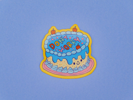 Colorful cake sticker with 'Don't Worry' text on a blue background