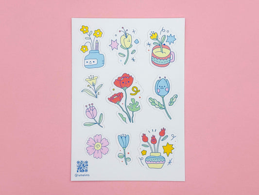 Sheet of colorful floral stickers on a pink background