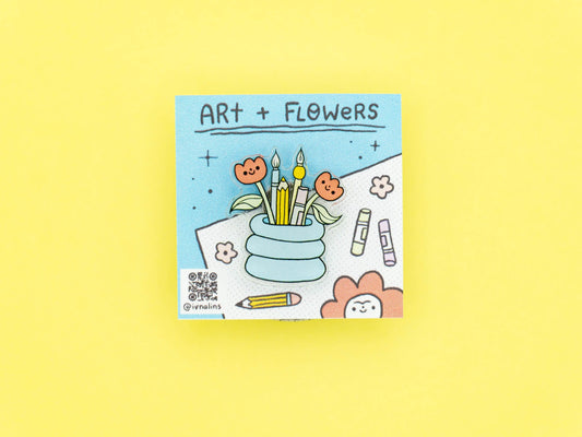 Pin with 'Art + Flowers' text and illustrations on a yellow background