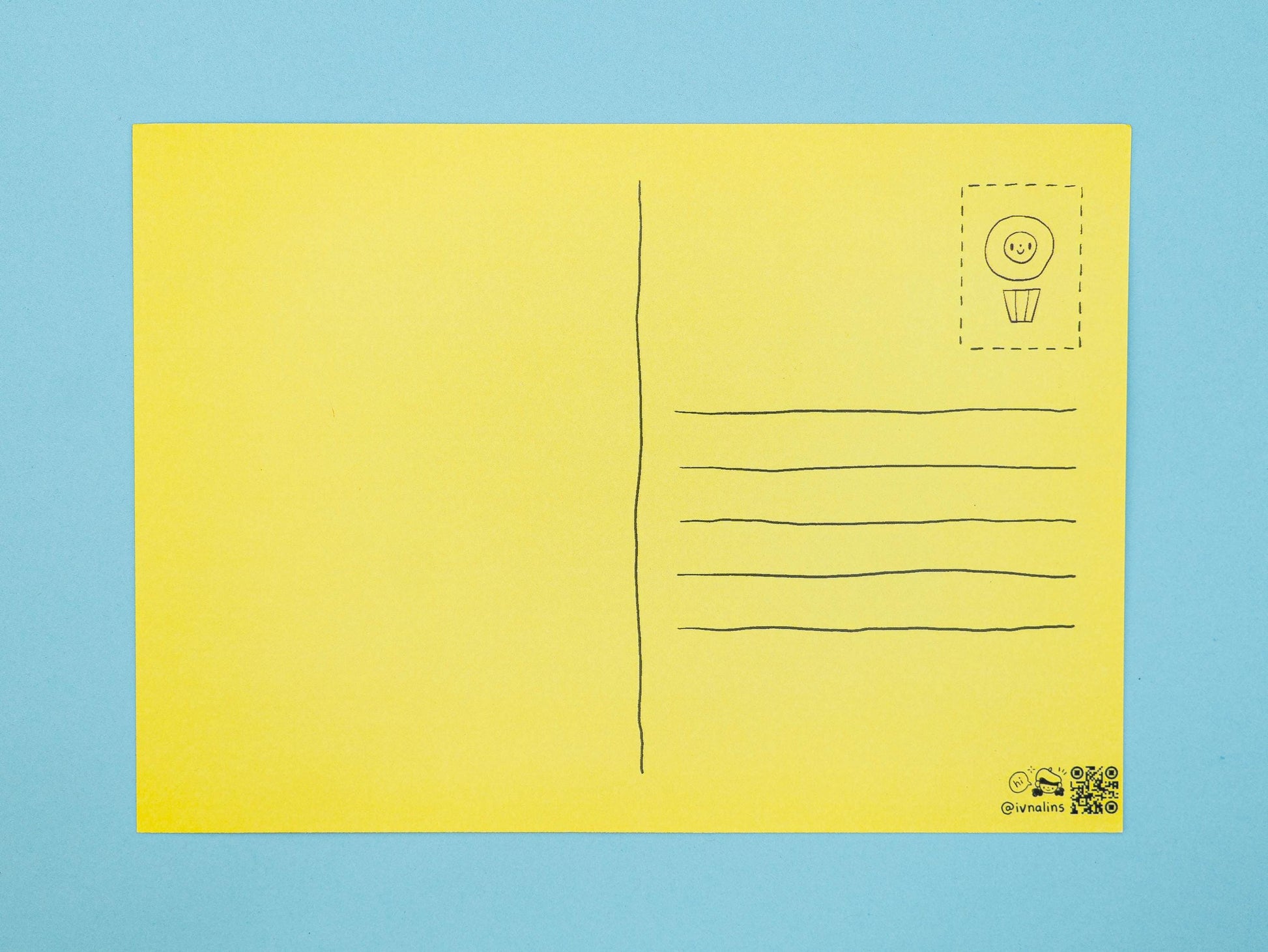 Yellow postcard with a smiley face design on a blue background