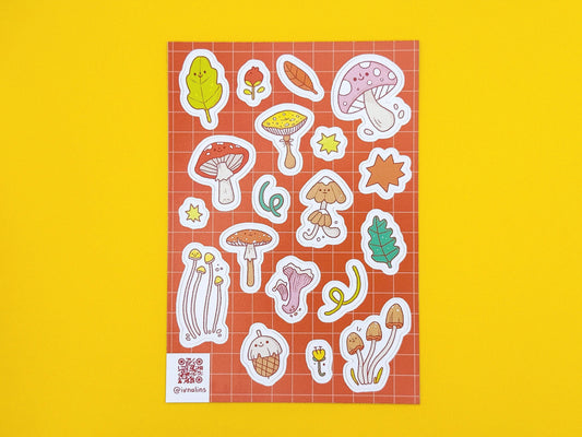 Sticker sheet with various mushroom and leaf designs on a yellow background