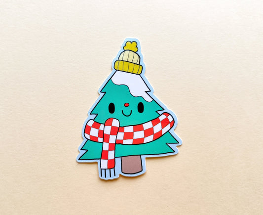 Sticker of a Christmas/Balsam fir tree with a hat and scarf on a beige background