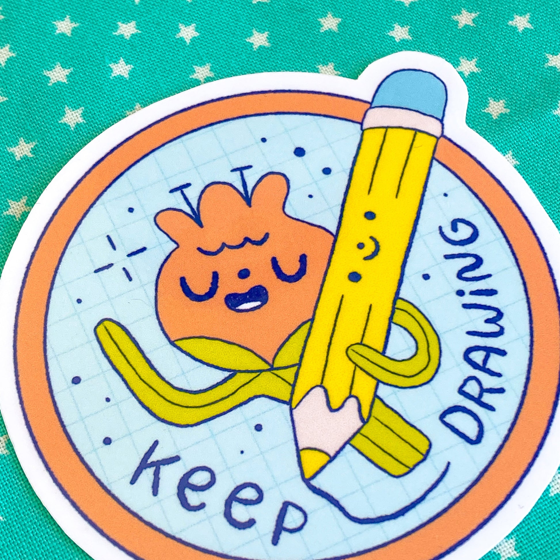 Illustration of a character holding a pencil with 'keep drawing' text on a teal background with star patterns.