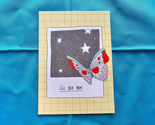 Card with a butterfly illustration and 'I'll be OK' text on a blue fabric background