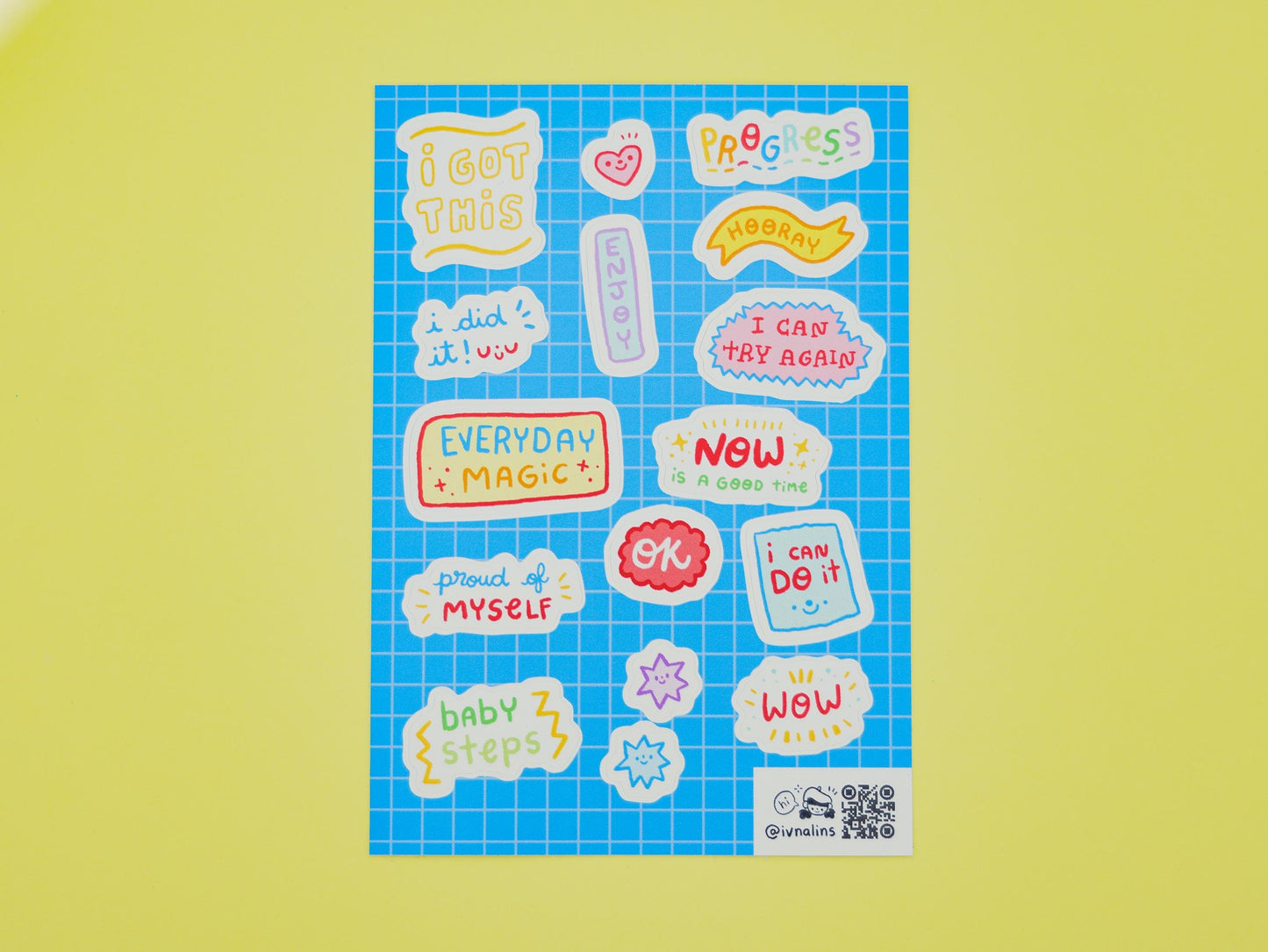 Sheet of colorful motivational stickers on a yellow background