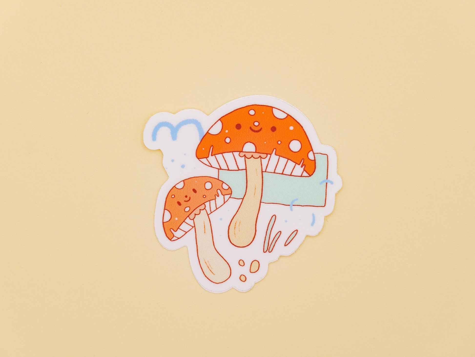 Sticker of two cartoon mushrooms on a beige background