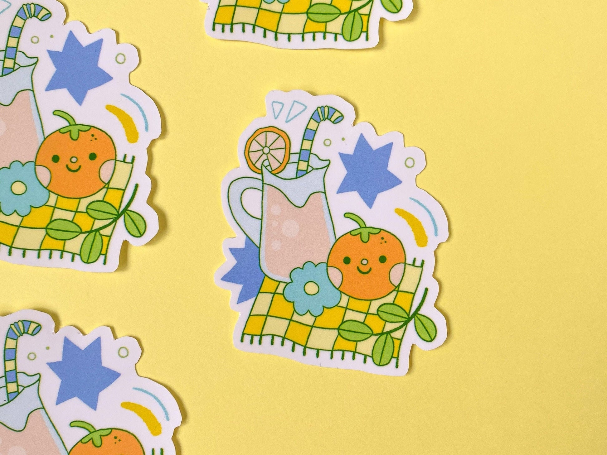 Cartoon stickers of a picnic with orange juice, an orange on a yellow background