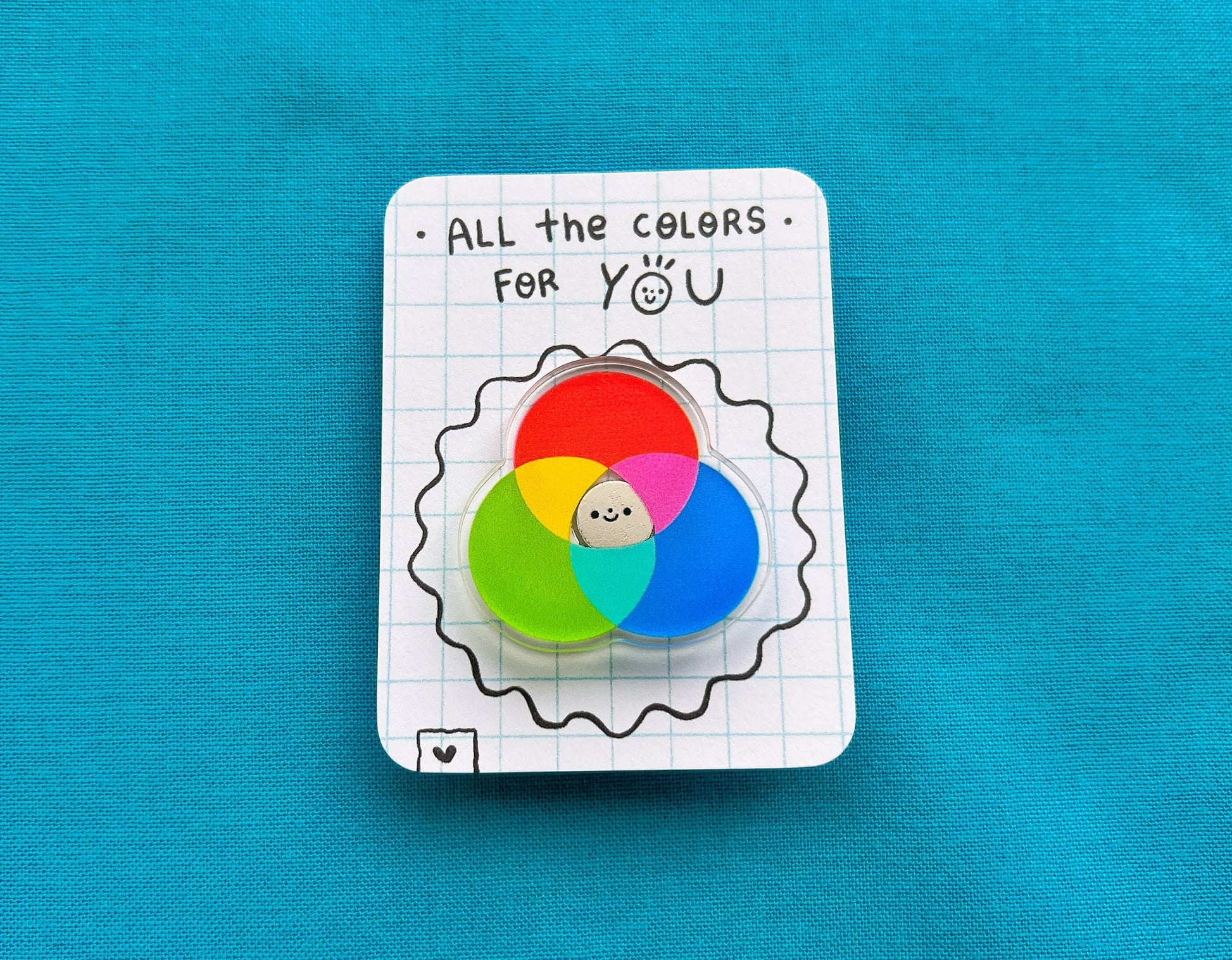 Color wheel badge on a card with 'All the colors for you' text on a blue background