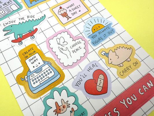 Collection of colorful stickers with various designs on a grid background